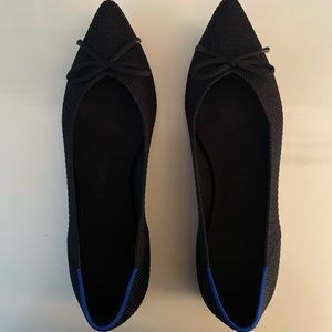 Rothy’s black pointed toe with bow flats